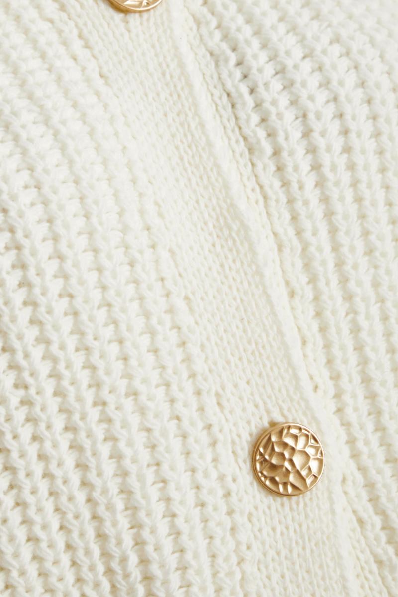 Бежевий в'язаний кардиган без рукавів